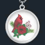 Collier Cardinaux rouges sur décoration de Noël<br><div class="desc">Oiseau cardinal rouge dessiné à la main perché sur un bouquet de Noël de branches de sapins poinsettia et de baies rouges</div>