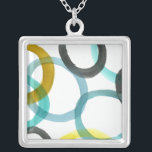 Collier Interverrouillage des cercles jaunes et bleus<br><div class="desc">Une simple impression de cercles jaunes et bleus imbriqués par Megan Meagher. L'arrière - plan blanc laisse apparaître les couleurs des cercles. Achetez le vôtre aujourd'hui !</div>