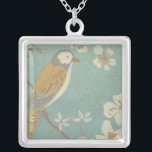 Collier Oiseau jaune, gris et beige perché sur une branche<br><div class="desc">Chariklia Zarris est connue pour ses oeuvres d'art abstraites. Dans ce dessin d'un profil d'oiseau sur un arrière - plan turquoise bleu,  elle saisit la simplicité de l'oiseau. Les fleurs blanches apportent une touche romantique. Customisez votre produit Zazzle préféré en utilisant cette belle image.</div>