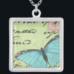 Collier Papillon à ailes bleues sur carte postale Turquois<br><div class="desc">Cette carte postale turquoise porte un message de beauté. Un délicat papillon à ailes bleues repose sur la carte,  obscurcissant une partie du script qu'il contient. Cette impression de Vision Studio ferait un grand ajout à votre maison!</div>