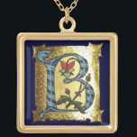 COLLIER PLAQUÉ OR LETTRE BLEUE OR B AVEC MONOGRAM FLEURS<br><div class="desc">Lettre initiale B florale médiévale sur arrière - plan or.</div>