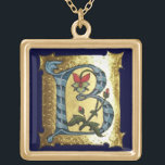 COLLIER PLAQUÉ OR LETTRE BLEUE OR B AVEC MONOGRAM FLEURS<br><div class="desc">Lettre initiale B florale médiévale sur arrière - plan or.</div>
