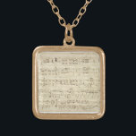 Collier Plaqué Or Partition sur parchemin manuscrite en encre<br><div class="desc">Old vintage sheet music music handink in black ink on an antique beige parchment with notes. Memories from a time long ago,  music quelque chose qui se passe en ink. Notations and scribblings on the side give it a personal touch.</div>