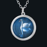 Collier Pretty white swan floating on blue lake<br><div class="desc">A lovely nature scene of a white swan swimming on a peaceful blue lake. The dark blue shadows contrasts nicely with the soft blue lighting on this peaceful swan.</div>