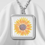 Collier Tournesol jaune<br><div class="desc">Ce collier floral est décoré d'un tournesol jaune aquarelle. Aquarelle originale © Michele Davies.</div>