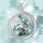 Collier Vintage Lily Broch Pastel Blue<br><div class="desc">Customisez ce magnifique collier pendentif fleuri avec ses initiales pour un cadeau vraiment élégant qu'elle chérira. L'image en bleu pastel est d'une broche métallique vintage d'une paire de lys et est ultra féminine et unique. Cette image est la photographie originale de bijoux de JLW_Photography.</div>