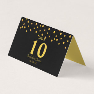 Confetti d'or sur carte de table de pliage noir