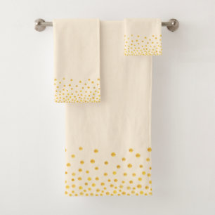 Confettis dorés élégants sur beige clair sableux