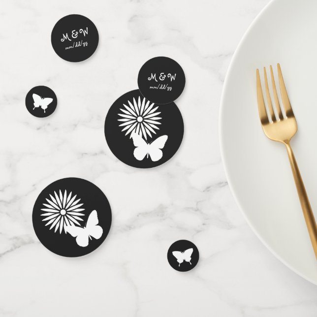 Confettis Marguerites et papillons dans la table noire Confe (Groupe)