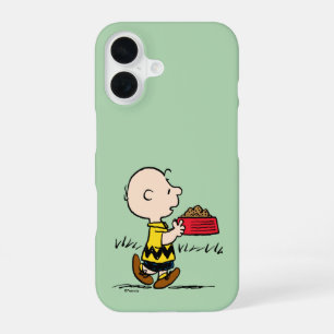 Coque iPhone 16 Peanuts Charlie Brown avec l'assiette de Snoopy