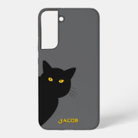 Les yeux jaunes chat noir vous saluant coutume