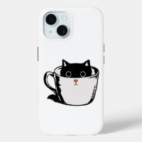 Chaton noir avec nez rouge caché dans une tasse