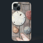 iPhone 13 Case Les trésors marins<br><div class="desc">Megan Meagher est connue pour ses oeuvres d'art simples. Cette image montre la simplicité des trésors du bord de mer, dont les dollars de sable et les coquillages dans un ton pastel. Meagher embrasse à son image un arrière - plan en bois pour contraster ces trésors. Obtenez cette impression fine...</div>