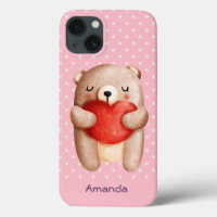 Ours en peluche mignon portant un coeur rouge