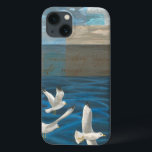 iPhone 13 Coque Three White Seagulls Flying Over the Water<br><div class="desc">Need to get away? Do it by choosing this painting by artist Tara Friel representing three seagulls flying over the water. The sight of the waves of the ocean and the vivid colors make this design very realistic.</div>