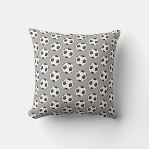 Coussin à motif de ballon de football noir et blan