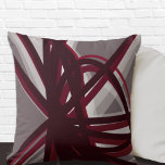 Coussin Abstrait artistique moderne<br><div class="desc">L'oreiller moderne est orné d'un design artistique élégant avec des tons gris blanc et bordeaux sur un arrière - plan gris. Cette composition abstraite est construite sur des combinaisons de rubans organiques répétés, qui se chevauchent et entrelacés pour former un design artistique intéressant. Les accents gris, bordeaux, blanc et vin...</div>