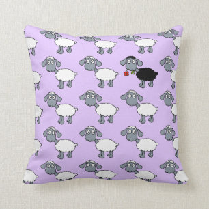 Coussin Agneau mouton noir avec fleur rouge dans un troupe