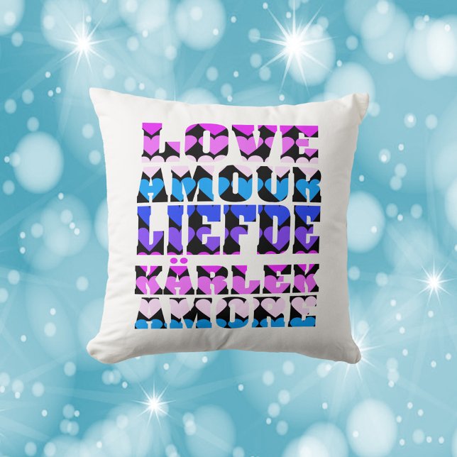 Coussin Amour Langues Étrangères Coeurs Rose Violet Noir (A pillow that says love in a variety of languages with hearts in pink, blue and purple.)