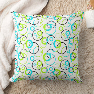 Coussin anneaux et cercles bleus, verts et noirs sur fond