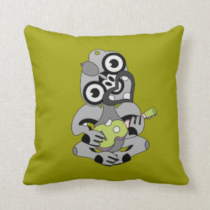 Coussin Aotearoa Hei Tiki avec ukulele vert