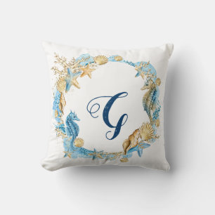 Coussin Aquarelle bleu et or sous le monogramme marin