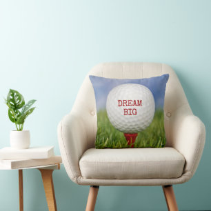 Coussin Balle de golf sur un tee rouge avec citation
