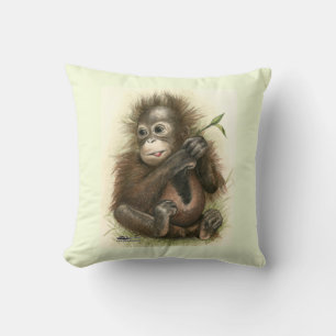 Coussin Bébé orang-outan avec des feuilles