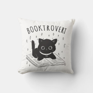 Coussin Booktrovert chat avec livre et étoiles