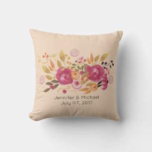 Coussin Bouquet de fleurs roses et orange sur fond pêche