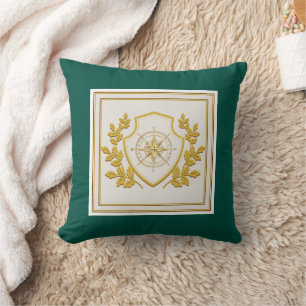 Coussin Boussole élégante à crête dorée sur fond vert émer