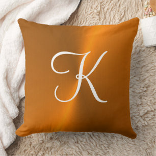 Coussin Bronze brillant faux monogramme métallique