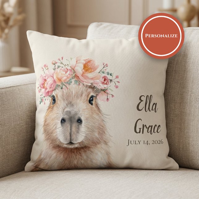 Coussin Capybara Baby Nursery • Personnalisé  (soft nursery pillow with floral capybara illustration on beige sofa setting)