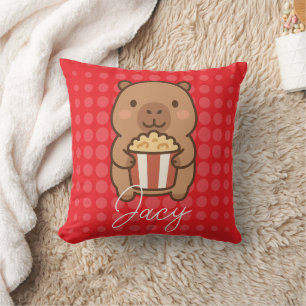 Coussin Capybara mignon mangeant du pop-corn