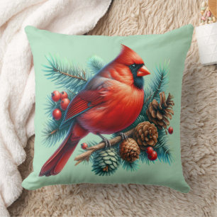 Coussin Cardinal sur la branche des pins avec les baies d'