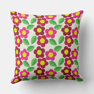 Coussin carré avec design floral rouge et rose.