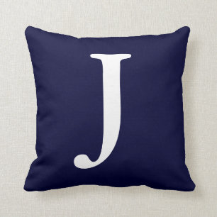 Coussin Carreau décoré d'un monogramme blanc du bleu