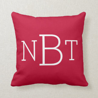 Coussin Carreau décoré d'un monogramme rouge et blanc