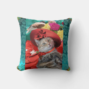 COUSSIN CÉLÉBRITÉ CAT PRINCESS TATUS, CASQUETTE ROUGE AVEC
