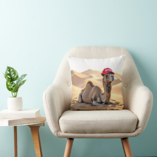 Coussin Chameau du désert portant une casquette rouge de r