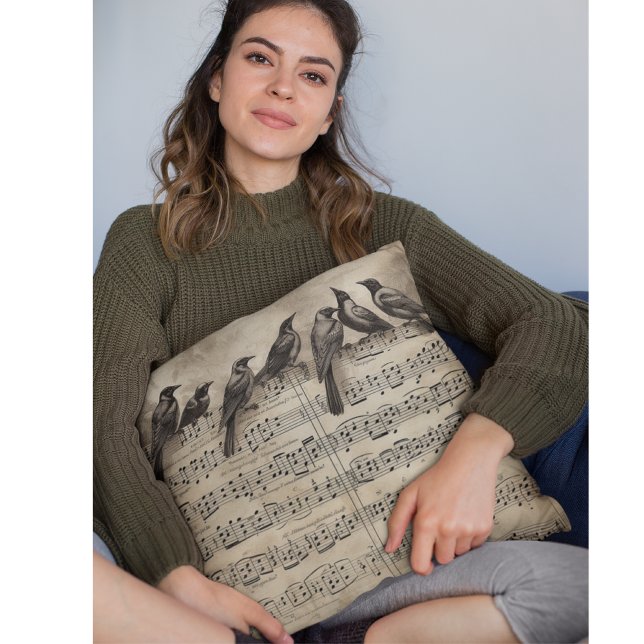 Coussin chant d'oiseaux assis sur une composition musicale (Créateur téléchargé)
