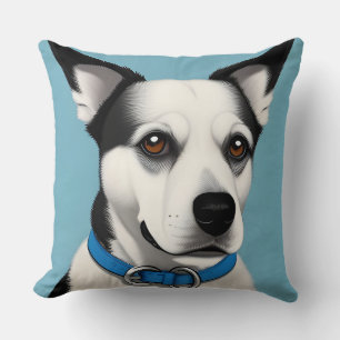 Coussin Chien noir et blanc avec collier bleu