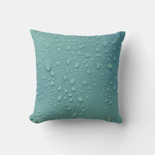 Coussin Cool gouttelettes d'eau sur un Arrière - plan bleu