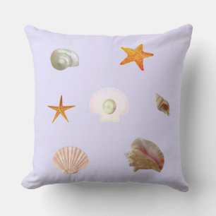 Coussin Coquilles, étoiles de mer et perle sur bleu lavand