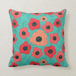 Coussin corail de pavot sur turquoise