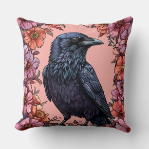 Coussin Corbeau noir entouré de fleurs roses et orange