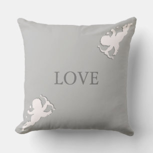 Coussin Cupidons élégants en blanc sur gris argenté