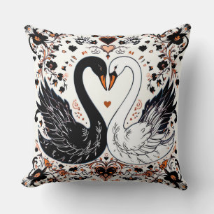 Coussin Cygnes noirs et blancs entourés de motifs floraux