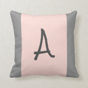 Coussin d'accentuation monographique rose et gris