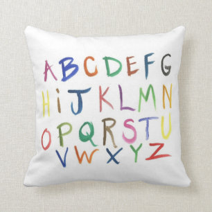 Coussin d'alphabet peint par aquarelle coloré